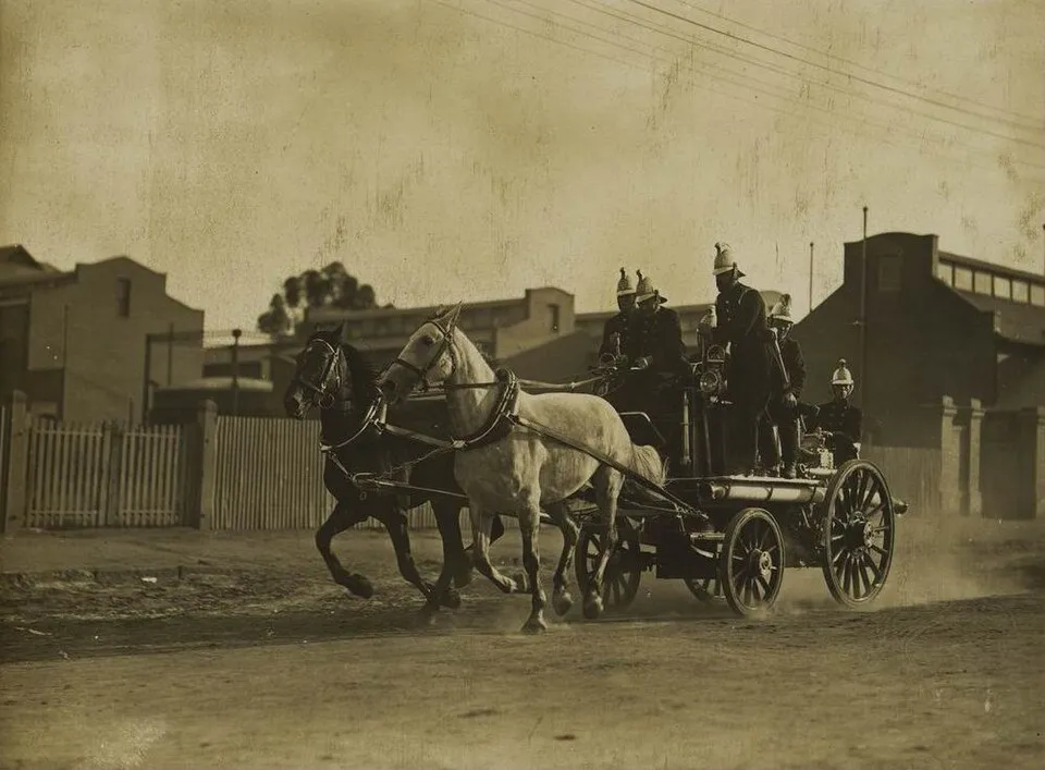 Horse-drawn fire equipment with polished brass fittings, 1880