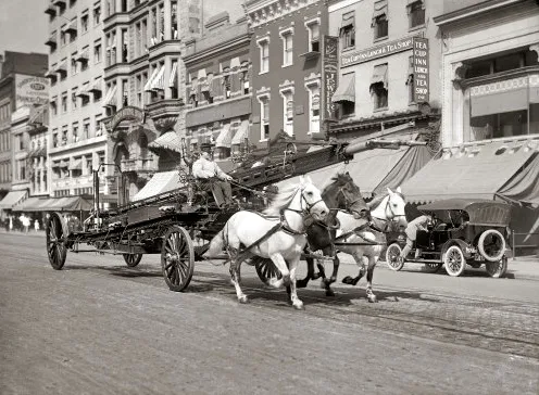 Horse-drawn fire truck traveling down F Street in Washington, D.C.