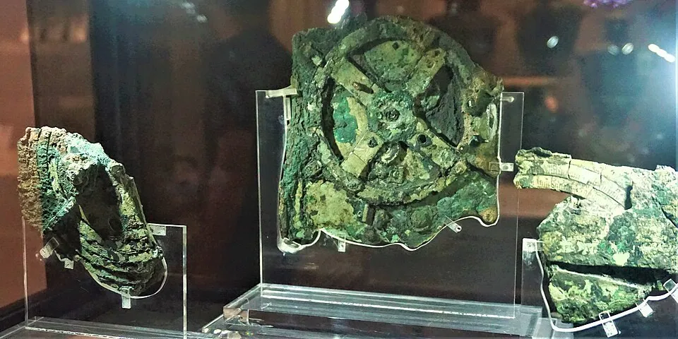 1 Antikythera_Mechanism_-_National_Archaeological_Museum,_Athens_by_Joy_of_Museum Antikythera Mechanism museum display